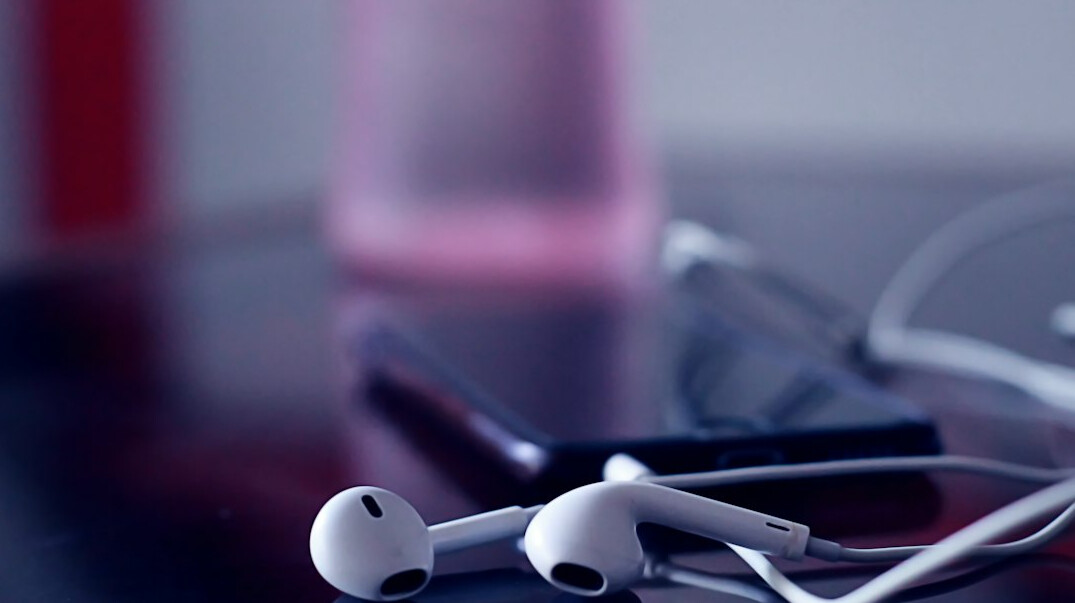 Podcast microphone and headphones in a bright recording studio