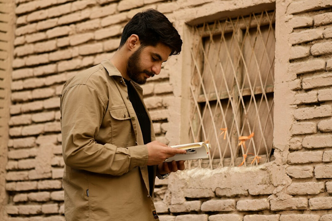 man reading old letters